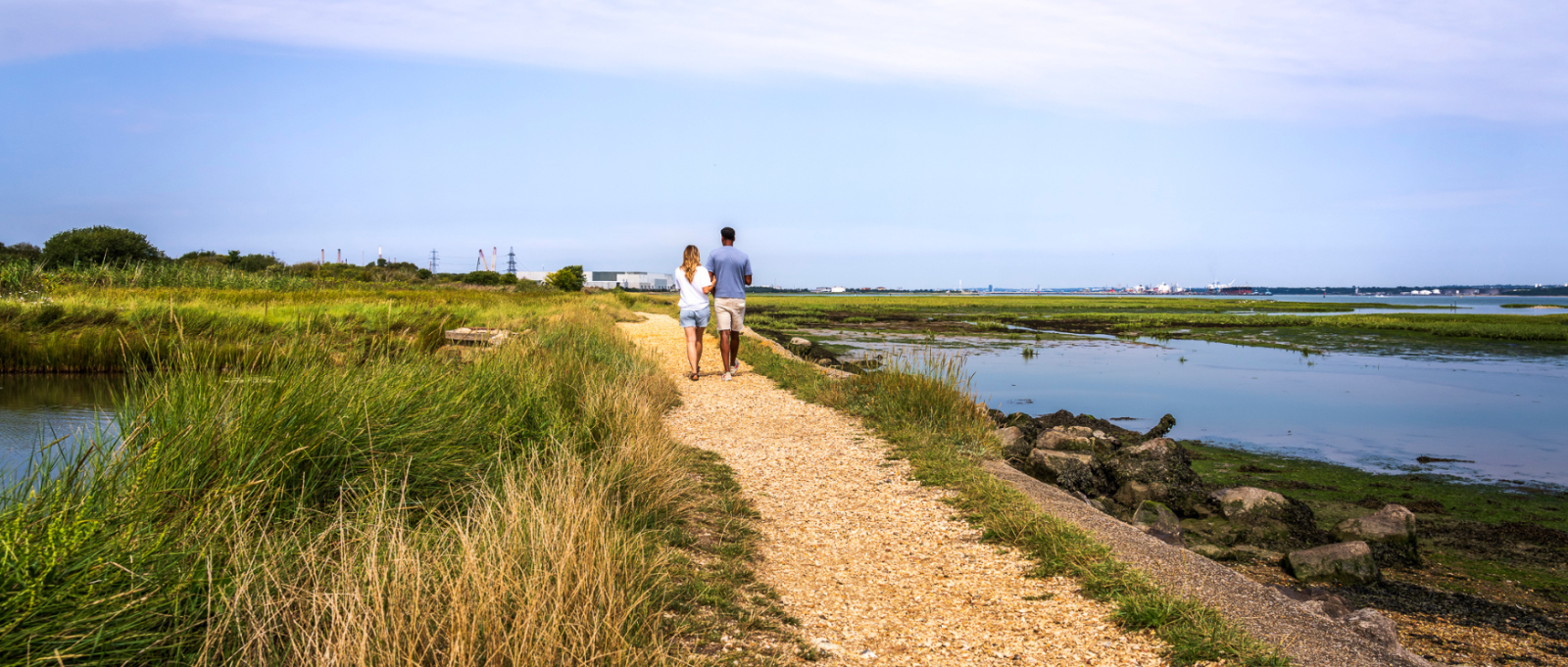 Couple walking at Calshot beach